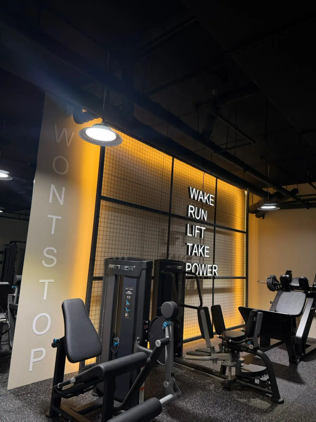 Modern strength equipment with orange feature lighting